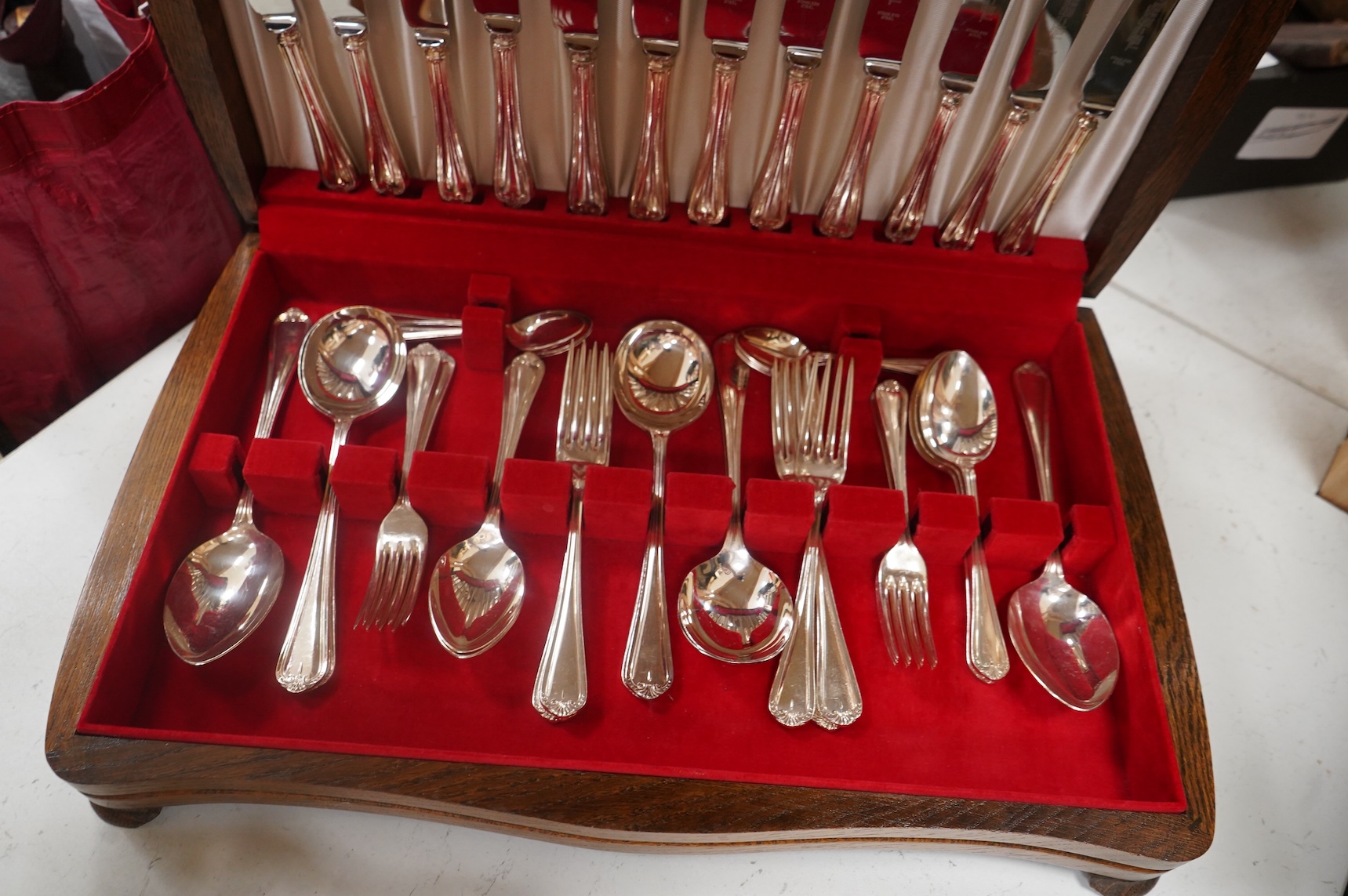 Webber & Hill, an oak cased canteen for six, a shaped galleried tea tray-60cm wide and tea service etc